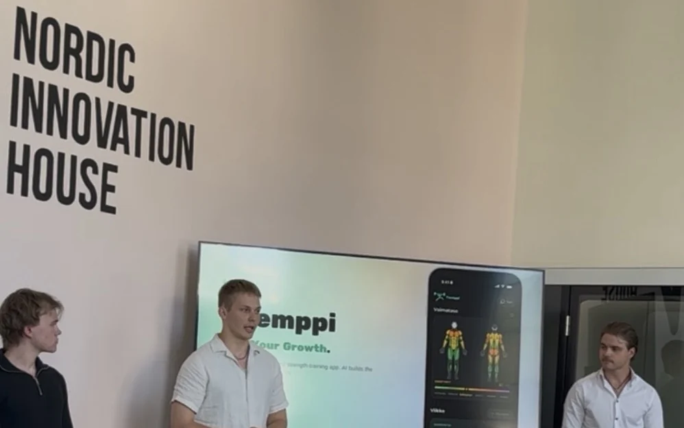 Tsemp founders pitching at Nordic Innovation House in Palo Alto, with the app on screen